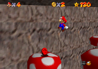 Mario reaching for a Red Coin in Tall, Tall Mountain.