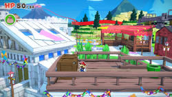 Mario standing near two crates containing a Coin each in Toad Town of The Origami King.