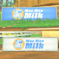 Trackside barricades with the logo in Mario Kart World