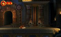 Donkey Kong kneels before two containers inside a Key Temple stage.