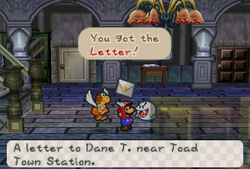 Mario receiveing a Letter from Franky in the Boo's Mansion of Paper Mario.