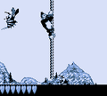 Donkey Kong passes a Zinger while holding on a rope