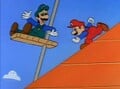 Luigi, using an elevator, beats Mario to the bottom of the pyramid