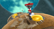 Mario holding a Spin Drill on Spin-Dig Galaxy.