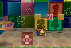 Image of Mario revealing a hidden ? Block in Shy Guy's Toy Box, in Paper Mario.