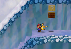 Image of Mario revealing a hidden ? Block in Shiver Mountain, in Paper Mario.