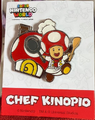 A metal pin of Chef Toad