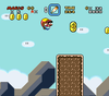Mario flying through an area from Chocolate Island 2, and is about to collect a Dragon Coin.