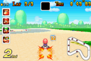 Mario taking the shortcut on the course in Mario Kart: Super Circuit. Note the added Item Box.