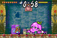 Screenshot of Wario battling Spoiled Rotten, who is accompanied by two Eggplant Warriors