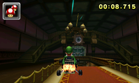 Luigi boosts through the foyer of DS Luigi's Mansion in Mario Kart 7.