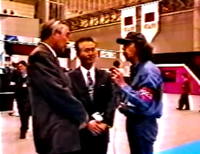 Gus Rodríguez (co-founder of the Mexican magazine Club Nintendo) interviewing Gunpei Yokoi with Teruhide Kikuchi (promoter of the aforementioned magazine) as Gus's interpreter.