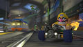 Wario, driving through the tunnel section of the track.