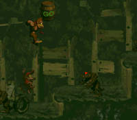 Donkey Kong bouncing at a Stop & Go Barrel from a tire near the end of Stop & Go Station in Donkey Kong Country
