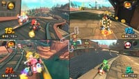 An official splitscreen screenshot of racers driving on Whistlestop Summit in Mario Kart World.