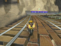 Wario driving on the Wario Bike with misplaced exhaust pipes on Wario's Gold Mine