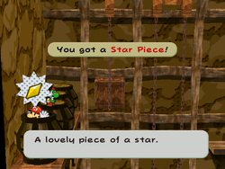 Mario getting the Star Piece in a barrel in the barrel room of the Pirate's Grotto in Paper Mario: The Thousand-Year Door.