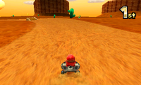 Shy Guy races in the Kalimari Desert in Mario Kart 7