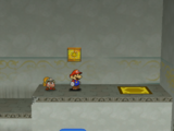 Mario next to the Shine Sprite in the warp area