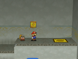 Mario next to the Shine Sprite in the warp area of Rogueport Sewers