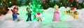 Photograph from the Play Nintendo website showing Super Mario series amiibo figures in a festive setting