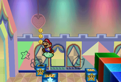 Mario finding 3 Coins above the first jack-in-a-box in Shy Guy's Toy Box of Paper Mario.