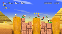 E3 2009 screenshot showing four-player mode of World 2-1 in New Super Mario Bros. Wii.