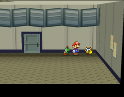 Mario near the Charge P badge in Glitz Pit of Paper Mario: The Thousand-Year Door.