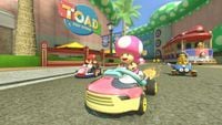 Toadette, Mario, and Lakitu race at Toad Harbor.