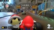 Mario holding a Red Shell on Live Circuit