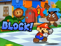 Mario performing a block against a Goomba in Paper Mario: Sticker Star.