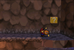 Image of Mario revealing a hidden ? Block in Mt. Lavalava, in Paper Mario.