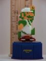 Pixelated figurine of Luigi stomping on a Goomba