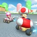 Toad drifting in the Mushmellow and Toadette drifting in the Daytripper