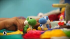 Screenshot of the first scene in episode 2 of Yoshi's Woolly World: Adventure Guide, the scene has Yoshi and a Light-blue Yoshi taking a walk on the set piece