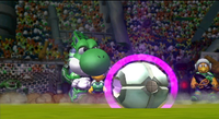 Yoshi prepares to kick the soccer ball in Mario Strikers Charged.