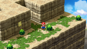 Mario in front of a crevice with the hidden button that fills up the holes in the upper part of the second scene of Booster Pass of Super Mario RPG.