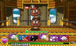 Screenshot of 2-Goomba Tower as the alternative boss of World 1-Airship, from Puzzle & Dragons: Super Mario Bros. Edition.