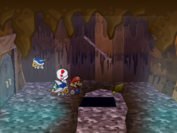 Mario getting the Star Piece under a hidden panel on the first floor in the room with three winged koopas in the Pirate's Grotto in Paper Mario: The Thousand-Year Door.