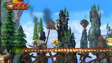 Funky Kong riding on Rambi the Rhino in Mountain Mania of Donkey Kong Country: Tropical Freeze for the Nintendo Switch