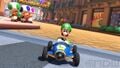 Luigi near the starting line. Waluigi is seen driving the opposite way in the background.