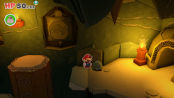 Mario standing near a rock containing a Healing Heart in Earth Vellumental Temple of The Origami King.