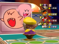 Red Boo attacking Wario in Card Party in the game Mario Party 5.