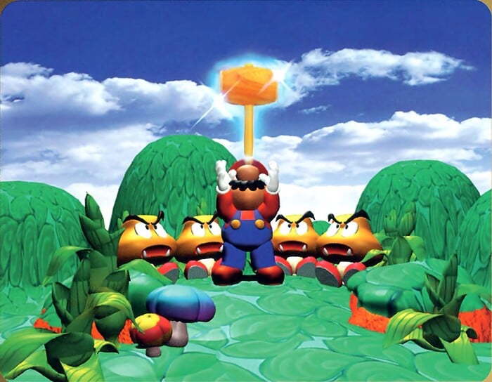 Mario, depicted in the Super Mario RPG: Legend of the Seven Stars. 3D style, stands upon grassy hills set against a blue sky with puffy white clouds. There are a few mushrooms and plants in the foreground. Mario has his head turned skywards and his hands outstretched as a glowing wooden hammer descends into his hands. Around Mario, four Goombas sit and look up at the hammer.