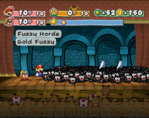 Mario and Goombella battling Fuzzy Horde in Shhwonk Fortress.