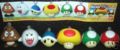 A group of keychains (from left to right): Goomba, Boo, Blue Shell, Mega Mushroom, 1-Up Mushroom, and Mushroom. Made by Bandai, released around January 2007 as part of the promotion of New Super Mario Bros.