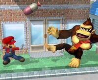 Mario throws a Capsule at Donkey Kong in Super Smash Bros. Melee.