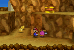 Mario finding 2 Coins on the lower ground between the trampoline and Star Piece surrounded by 6 Coins, all found in the scene north of the second scene of Mt. Rugged of Paper Mario.