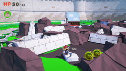 Mario standing near 2 100-Coins in Toad Town of The Origami King.