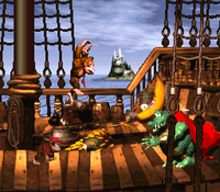 The Kongs starting the boss fight against King K. Rool on Gang-Plank Galleon in Donkey Kong Country
